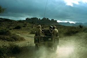 Members of the British army driving through Aden