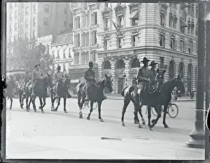 Members of the Third Cavalry Riding Down Street