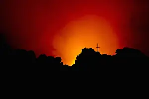 Color Ima Prints: Memorial cross silhouetted on Mount Nyiragongo Volcano
