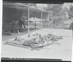 Men Aiming Rifles