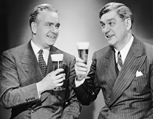 Two men with alcoholic beverages