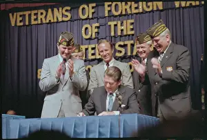 Men Applauding President Reagan's Signing of Document