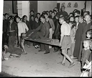 Stretcher Prints: Men Carry Hungry Woman Off On Door-Stret