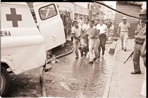 Ambulance Prints: Men Carry Victim to Ambulance on Street