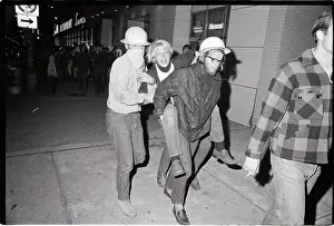 Tear Gas Prints: Men Carrying Fellow Protester