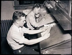 Repetition Prints: Men At Desks Proofreading Documents