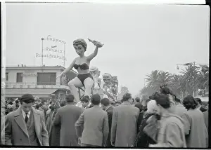 Men Gathering Around a Paper-Mache Float