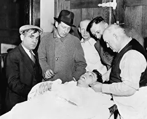 Men Gazing at Body of Gangster Dutch Shultz