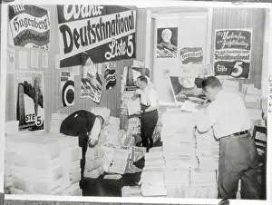 Two Men Going Through German Propaganda Materials