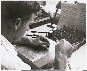 Men Hammering to Make Music Notes