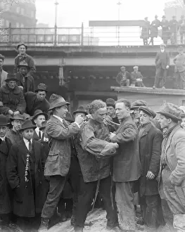 Men Helping Houdini into Straitjacket