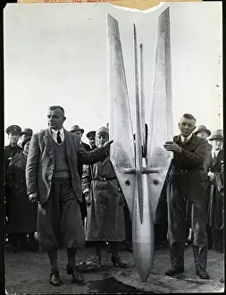 Rocket Prints: Two Men Hold up a Rocket