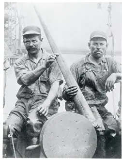 Men Holding Swordfish Bill