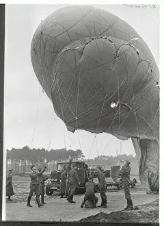 Men Inflating Balloon