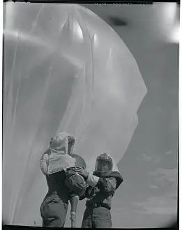 Men Inflating a Weather Balloon