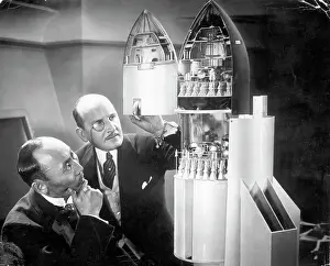 Retrofuturism Prints: Men Inspecting Rocket Ship Model