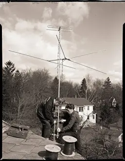 Installing Prints: Men Installing Rooftop Antenna