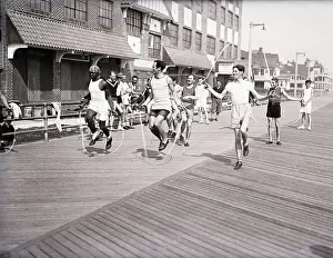Runner Prints: Men Jump Rope Down The Boardwalk