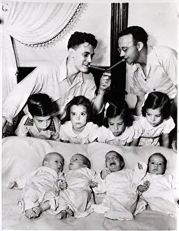 Quadruplets Prints: Men Light Cigars Above Quadruplets