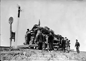 Skyscape Prints: Men Load Vehicle Onto Hand Cars