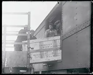 Men Loading Crates onto Train