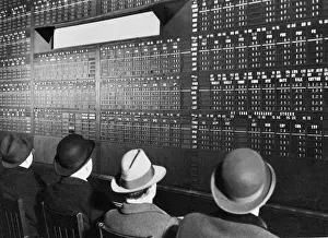 Fedora Prints: Men Look at Wall Street Quotation Board