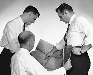 Button Down Shirt Prints: Three men looking at blueprint