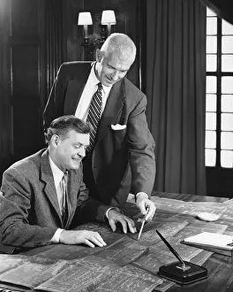 Only Mature Men Prints: Two men looking at blueprints