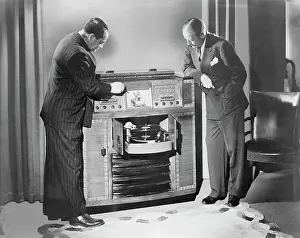 Men Looking at Television and Radio