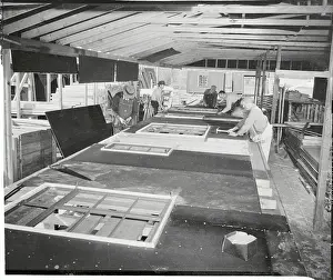 Men Making Wall Panels and Roof Trusses for Houses