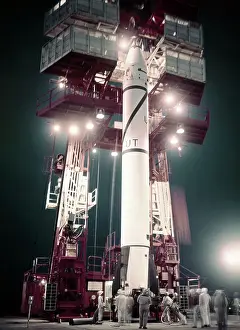 Men Observing Rocket Raised for Takeoff