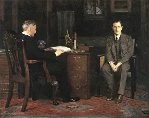 Attention Prints: Two men are in an office, one sitting at a desk and the other on a chair