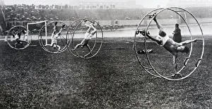 Racing Prints: Men Participating in Cat-in-the-Wheel Race