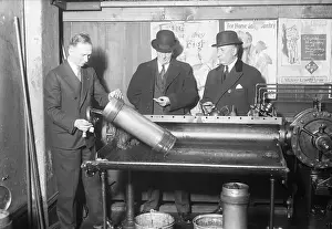 Airport Prints: Men Place Mail in Pneumatic Tube Machine
