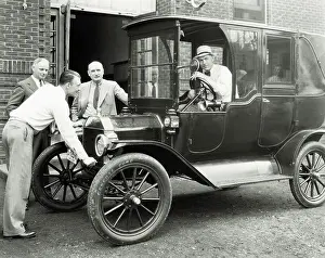 Men Posing with Early Ford Automobile