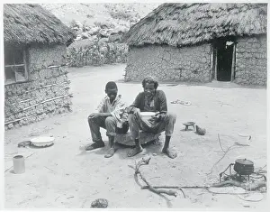Two Men Resting on a Rock