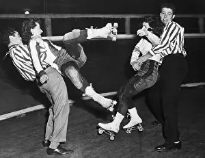 Men Restraining Women Roller Skaters