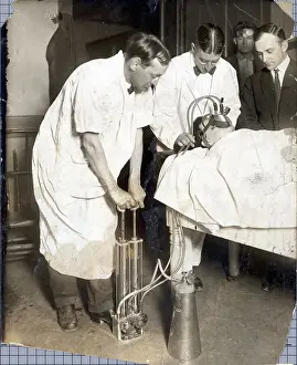 Oxygen Prints: Men Reviving Man With Oxygen Pump