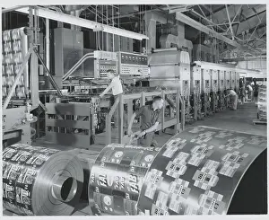 Men Rolling Out Aluminum Foil
