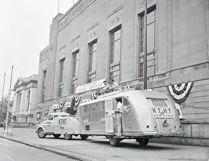 Men Setting up Mobile Radio Unit