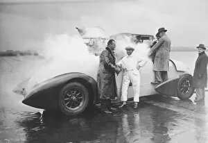 Images Dated 31st August 2005: Men standing around liquid oxygen propulsion car (B&W)