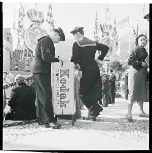 Men Standing at a Writing Stand