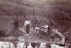 Men Beside Stream Ready To Pan For Gold