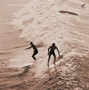 Silhouette Gallery: Men surfing waves
