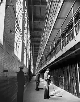 Men Sweeping in Prison