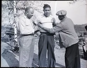 Measuring Prints: Men Taking Joe Louis Chest Measurements