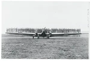 Men Testing a Plane's Wing Rigidity