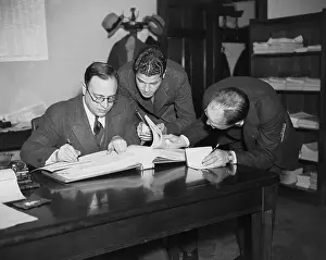Employee Prints: Men Thumbing Through a Sucker List
