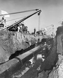 Little Rock Prints: Men In Trench Joining Pipeline Seam