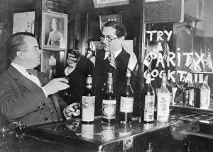 Men Trying Drink; Bottles On Bar